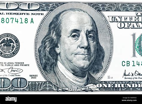 Close Up Overhead View Of Benjamin Franklin Face On 100 Us Dollar Bill