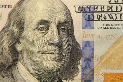 Close Up Portrait Of American President Benjamin Franklin On A 100