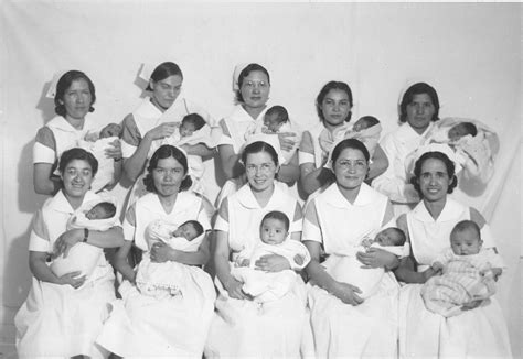 Nurses Holding Babies At The Sage Memorial Hospital At The Ganado