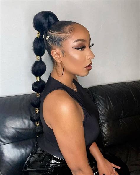 Sleek Long Ponytail With A Braided Wrap Black Ponytail Hairstyles
